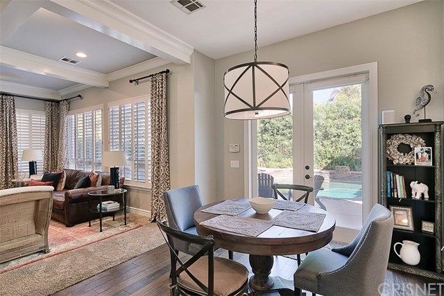 25907 Franklin Lane Stevenson Ranch, CA 91381 - Photo 17 of 58 Great eating area between kitchen and Family room with French doors to back yard and lovely light fixture.