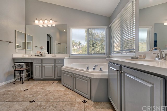 25907 Franklin Lane Stevenson Ranch, CA 91381 - Photo 29 of 58 Vanity make up area and vaulted ceilings with beautiful fixtures
