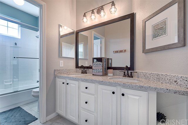 25907 Franklin Lane Stevenson Ranch, CA 91381 - Photo 35 of 58 Upstairs full bath with dual sinks, granite counters and shower/tub combo