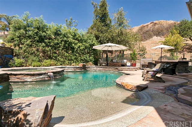 25907 Franklin Lane Stevenson Ranch, CA 91381 - Photo 48 of 58 Beach entry pebble tec and spa with water fall