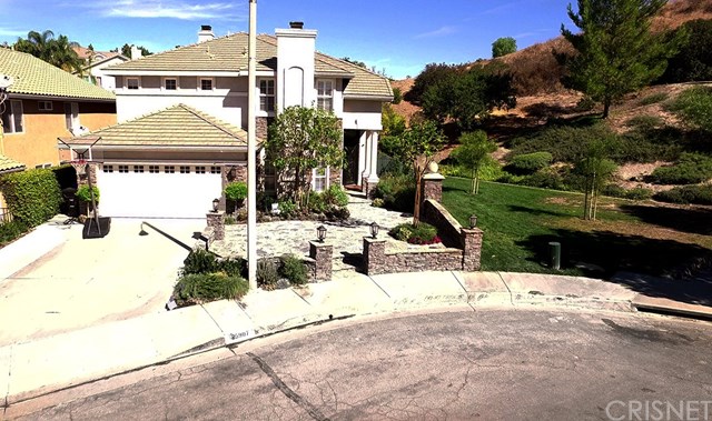 25907 Franklin Lane Stevenson Ranch, CA 91381 - Photo 56 of 58 Front view showing no neighbor on one side, just large area with lots of trees and landscaping