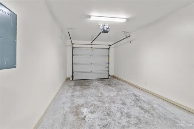 a view of a room with stairs and white walls