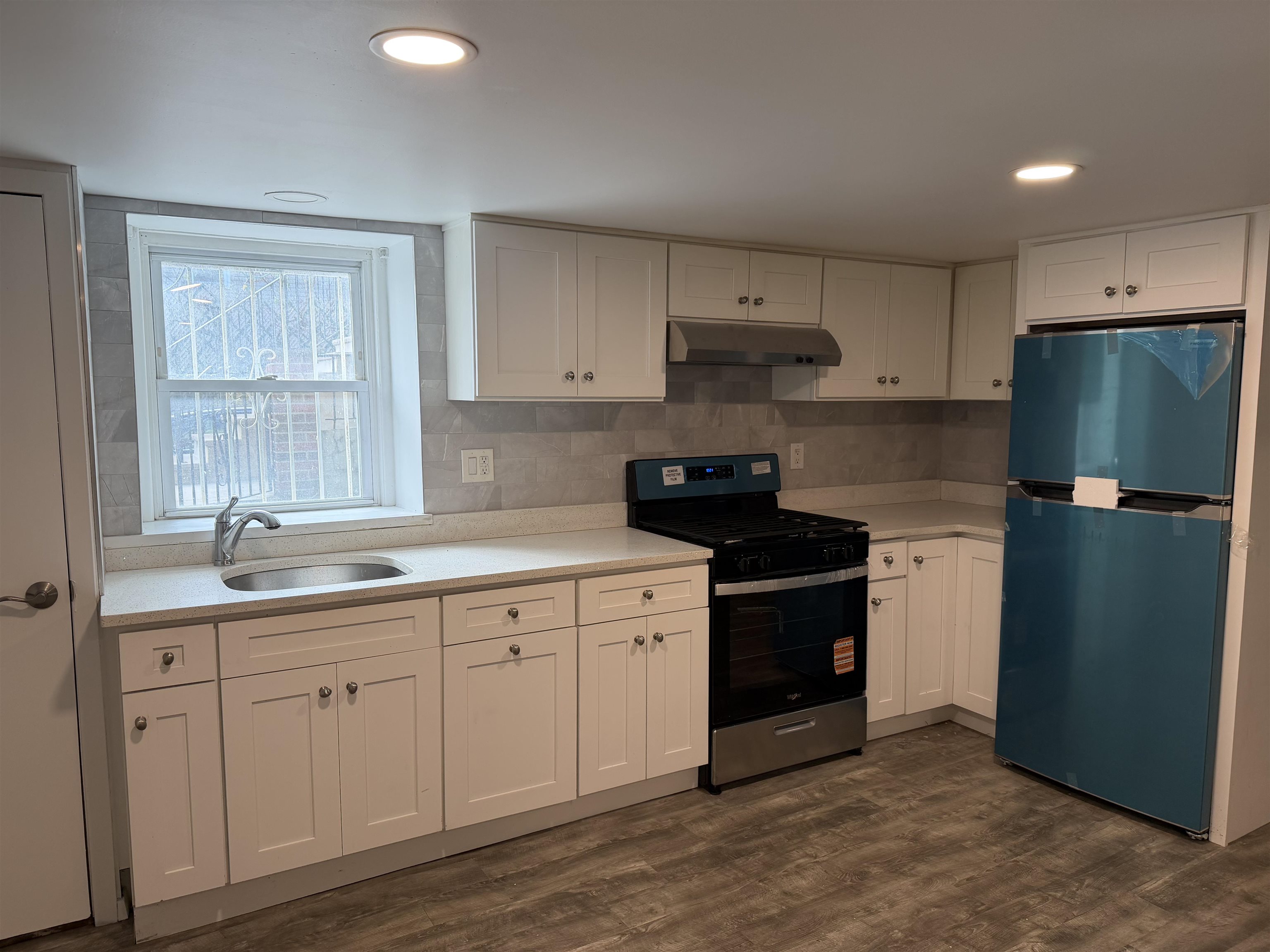 290 Paterson Plank Road, Unit 1 Jersey City, NJ 07307 - Photo 4 of 17 a kitchen with stainless steel appliances granite countertop a refrigerator sink and cabinets