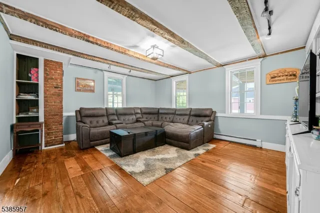 a living room with furniture and a rug