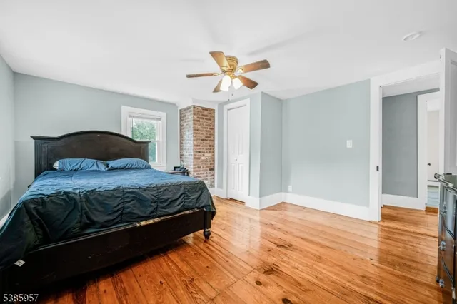 a bed sitting in a bedroom and chair