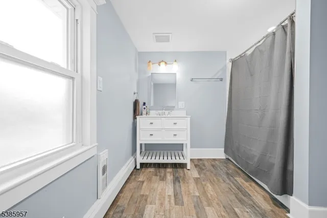 a view of a forest with a houses