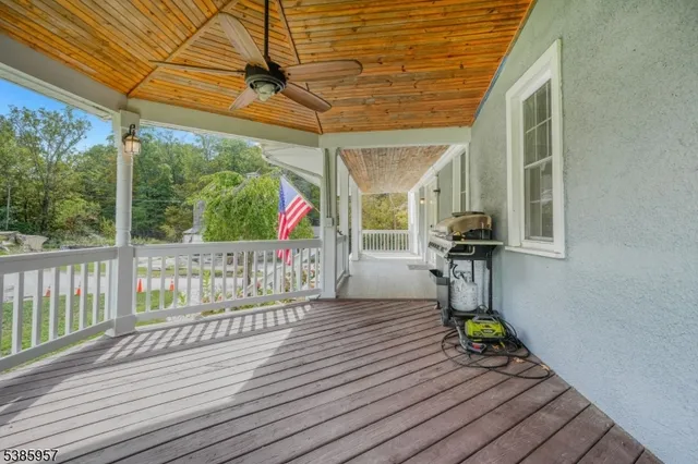 a view of a deck with wooden floor and outdoor space