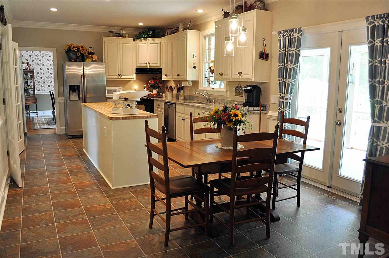 3161 Fieldstone Lane Mebane, NC 27302 - Photo 2 of 30 a view of a dining room with furniture