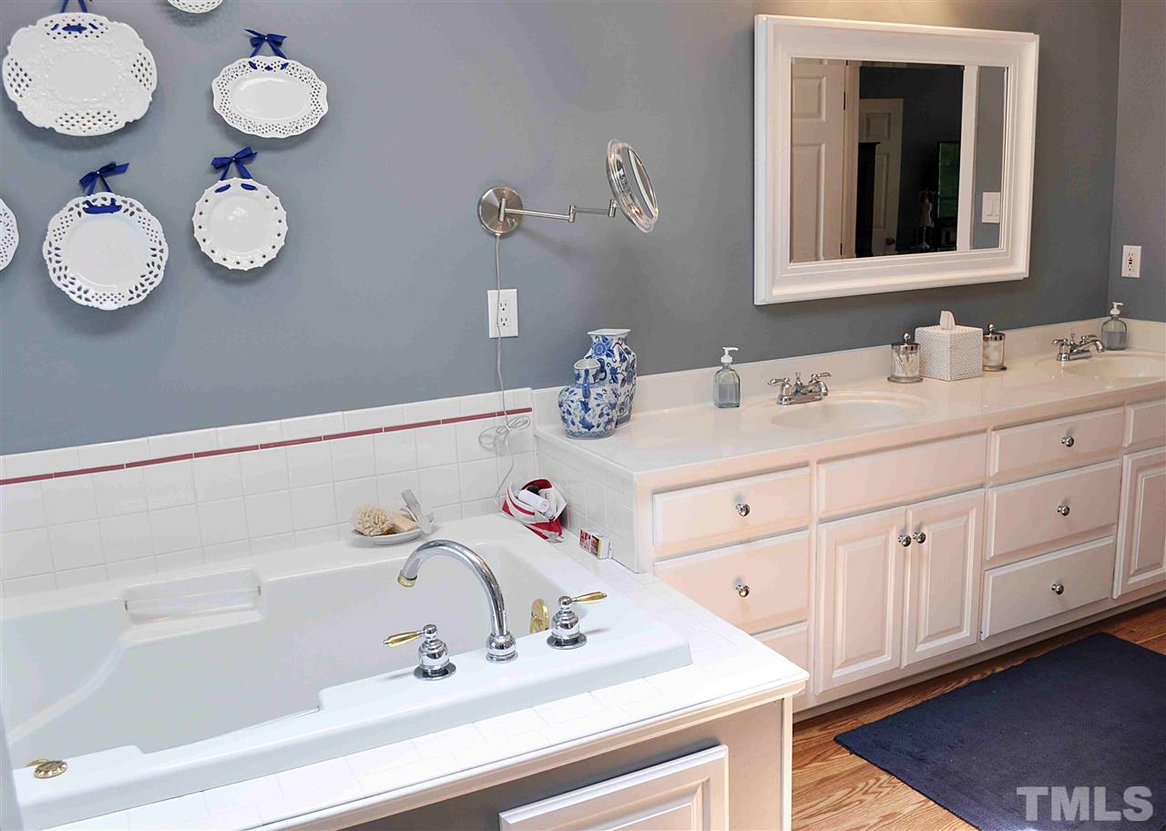 3161 Fieldstone Lane Mebane, NC 27302 - Photo 22 of 30 a bathroom with a sink and a mirror