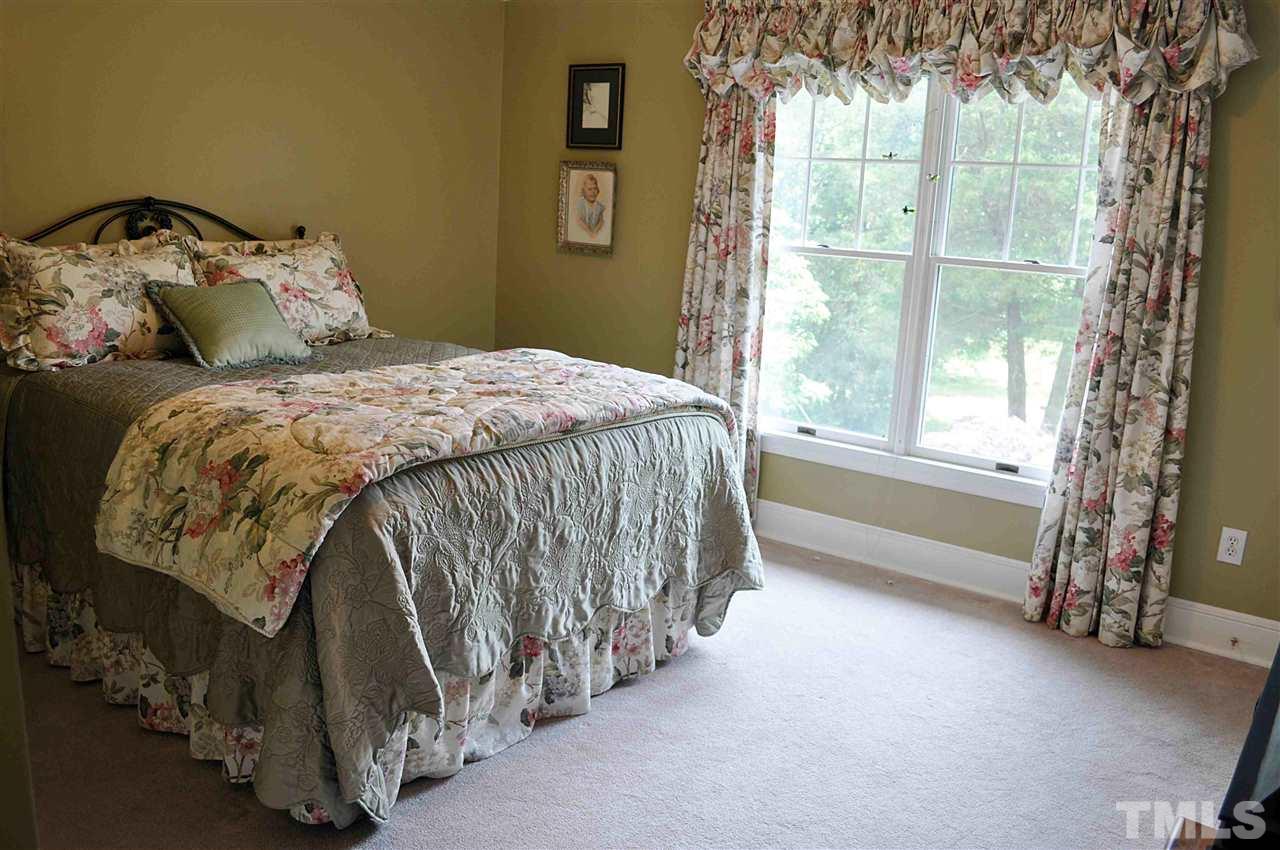 3161 Fieldstone Lane Mebane, NC 27302 - Photo 8 of 30 a bed sitting in a bedroom next to a window