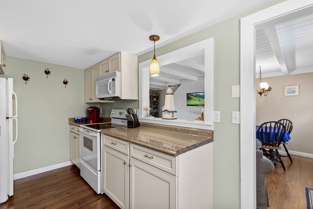 78 Upper County Road Dennis Port, MA 02639 - Photo 14 of 41 a kitchen with stainless steel appliances granite countertop a sink stove and cabinets
