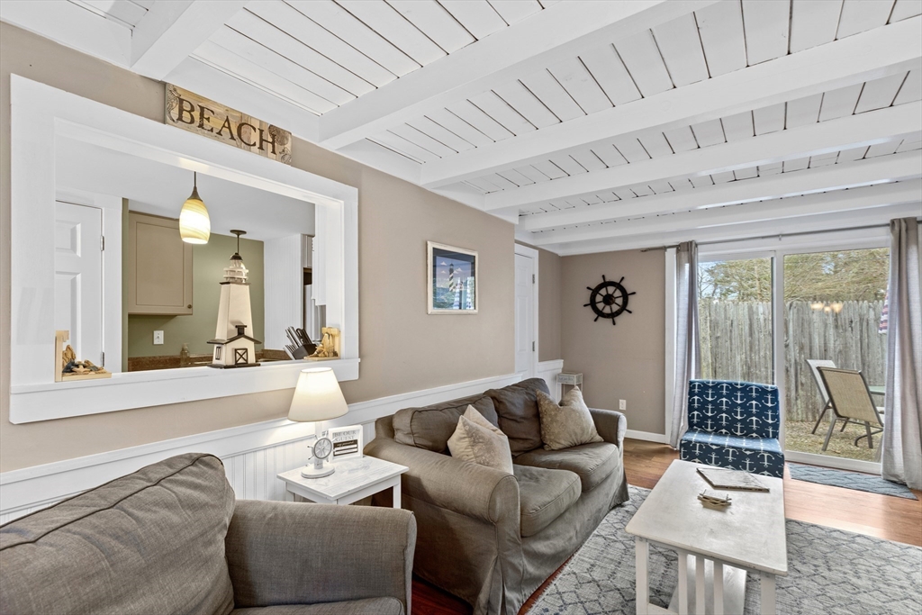 78 Upper County Road Dennis Port, MA 02639 - Photo 5 of 41 a living room with furniture and a large window
