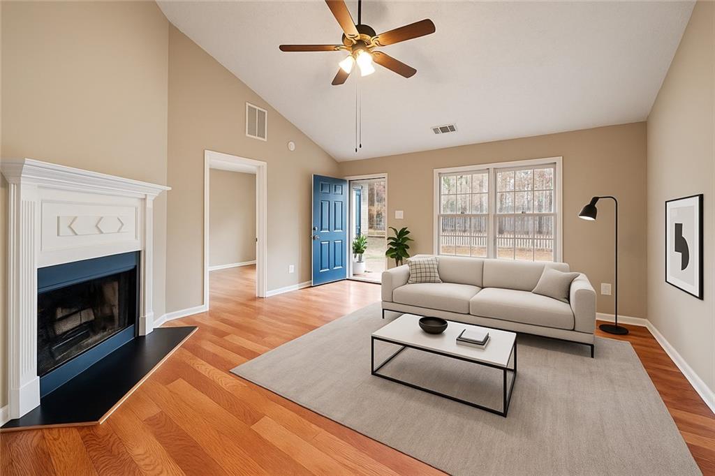 42 Crow Court Monticello, GA 31064 - Photo 5 of 33 a living room with furniture a fireplace and a window