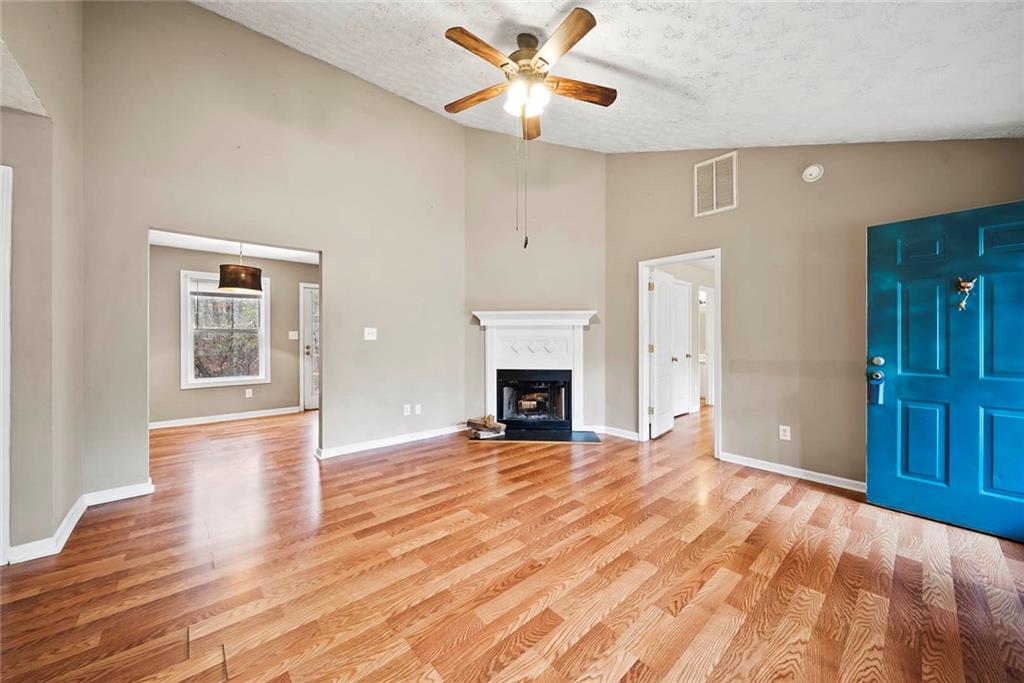42 Crow Court Monticello, GA 31064 - Photo 7 of 33 a view of an empty room with window and fire place