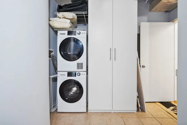 a close view of a utility room with dryer and washer