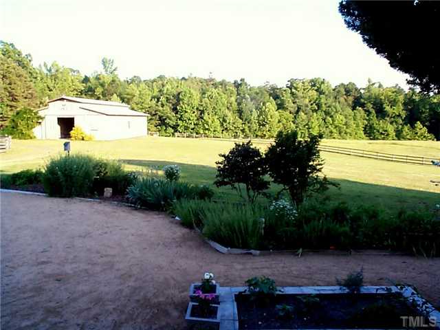 6097 Bob Daniel Road Oxford, NC 27565 - Photo 13 of 24 a view of a back yard of the house