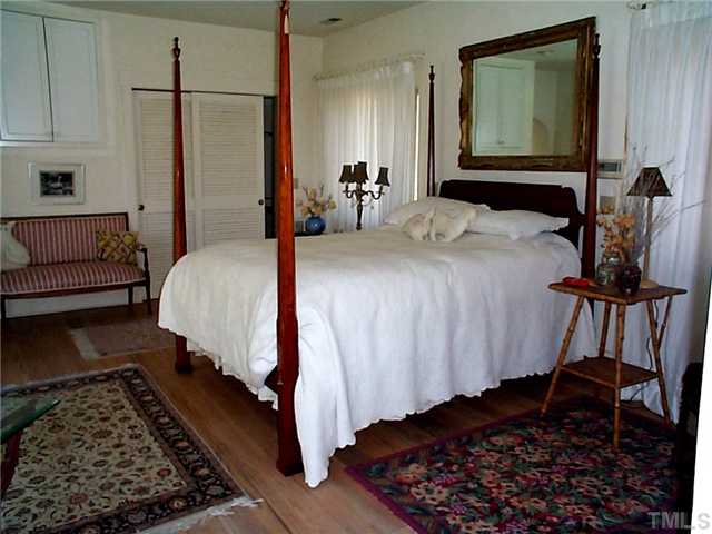 6097 Bob Daniel Road Oxford, NC 27565 - Photo 9 of 24 a bed room with a bed and a couch