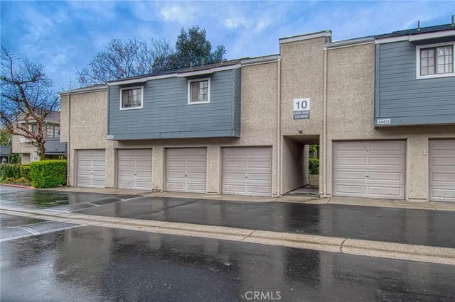 a front view of a house with garage