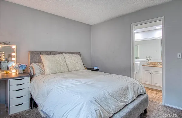a bedroom with a bed and a cabinets