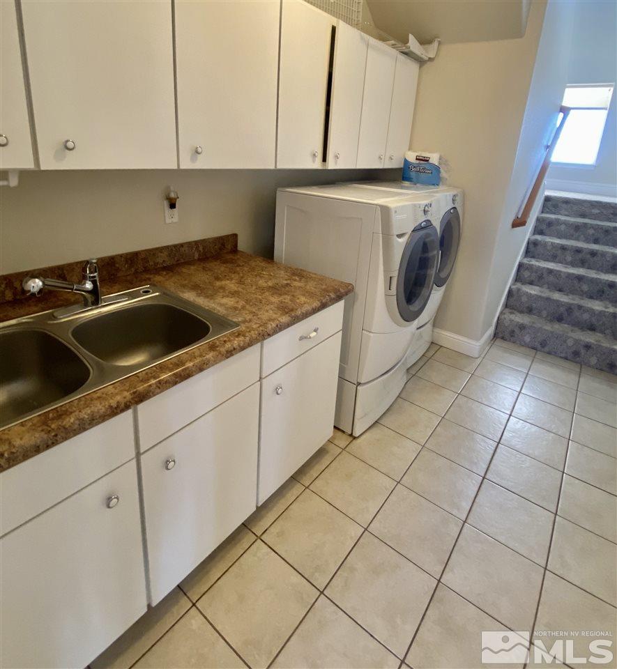 10275 Pathfinder Drive Reno, NV 89508 - Photo 13 of 26 a kitchen with a sink a stove and cabinets