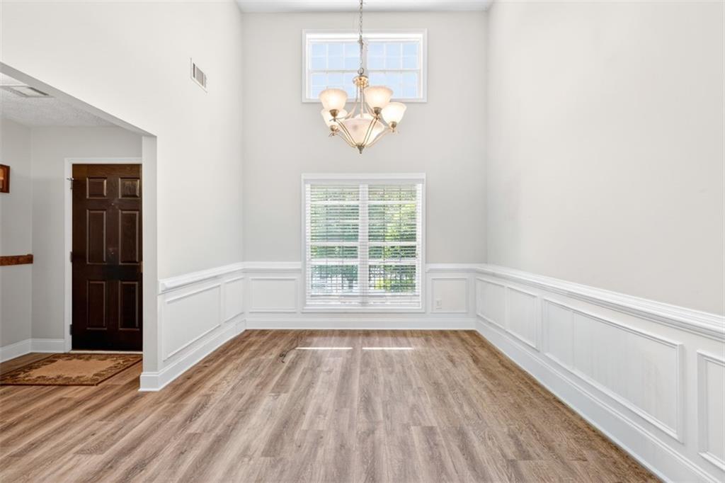 89 Katie Spring Lane Jefferson, GA 30549 - Photo 24 of 63 a view of empty room with wooden floor and fan
