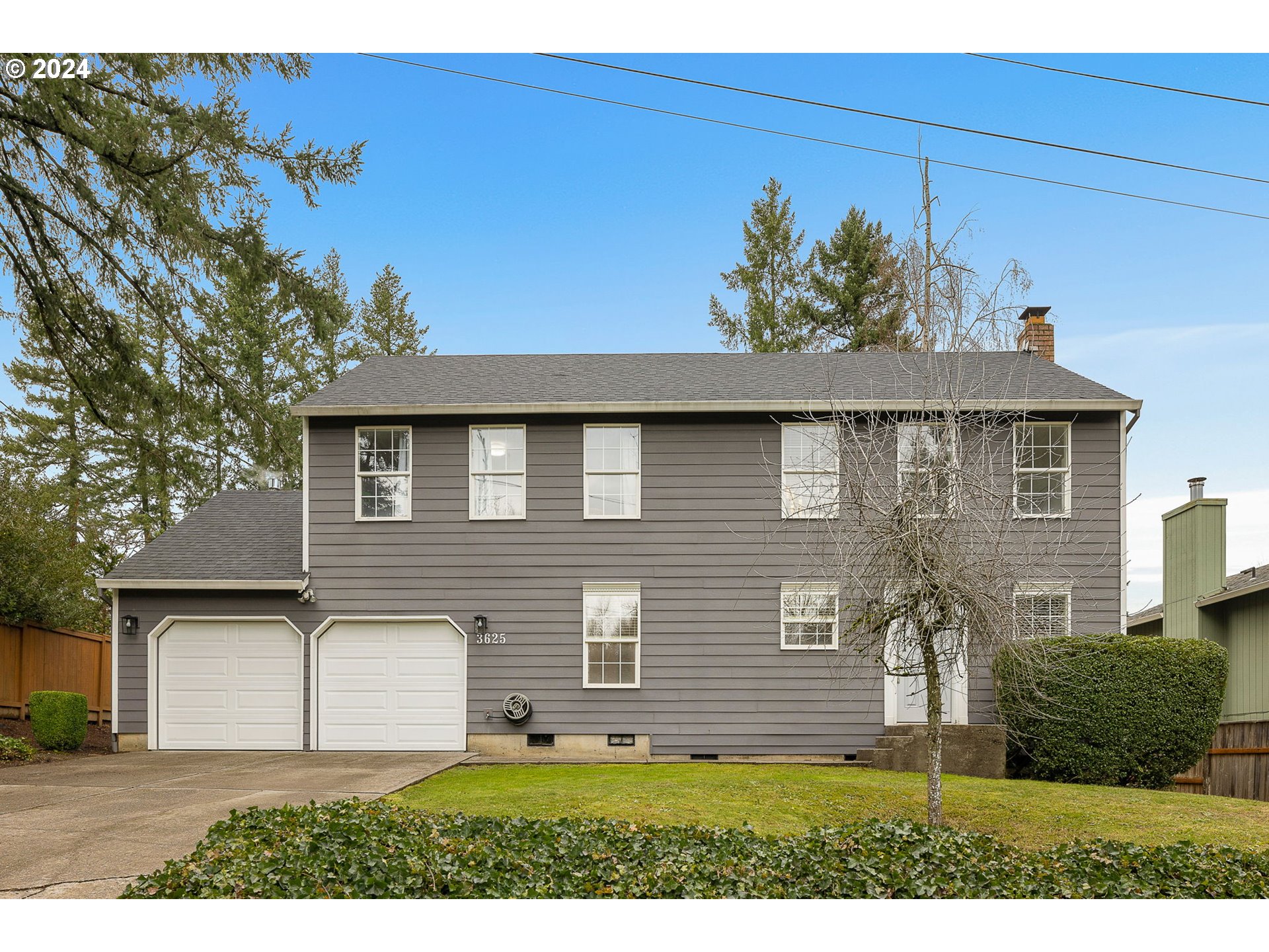 3625 Southwest Vacuna Street Portland, OR 97219 - Photo 1 of 27 a view of a house with a yard