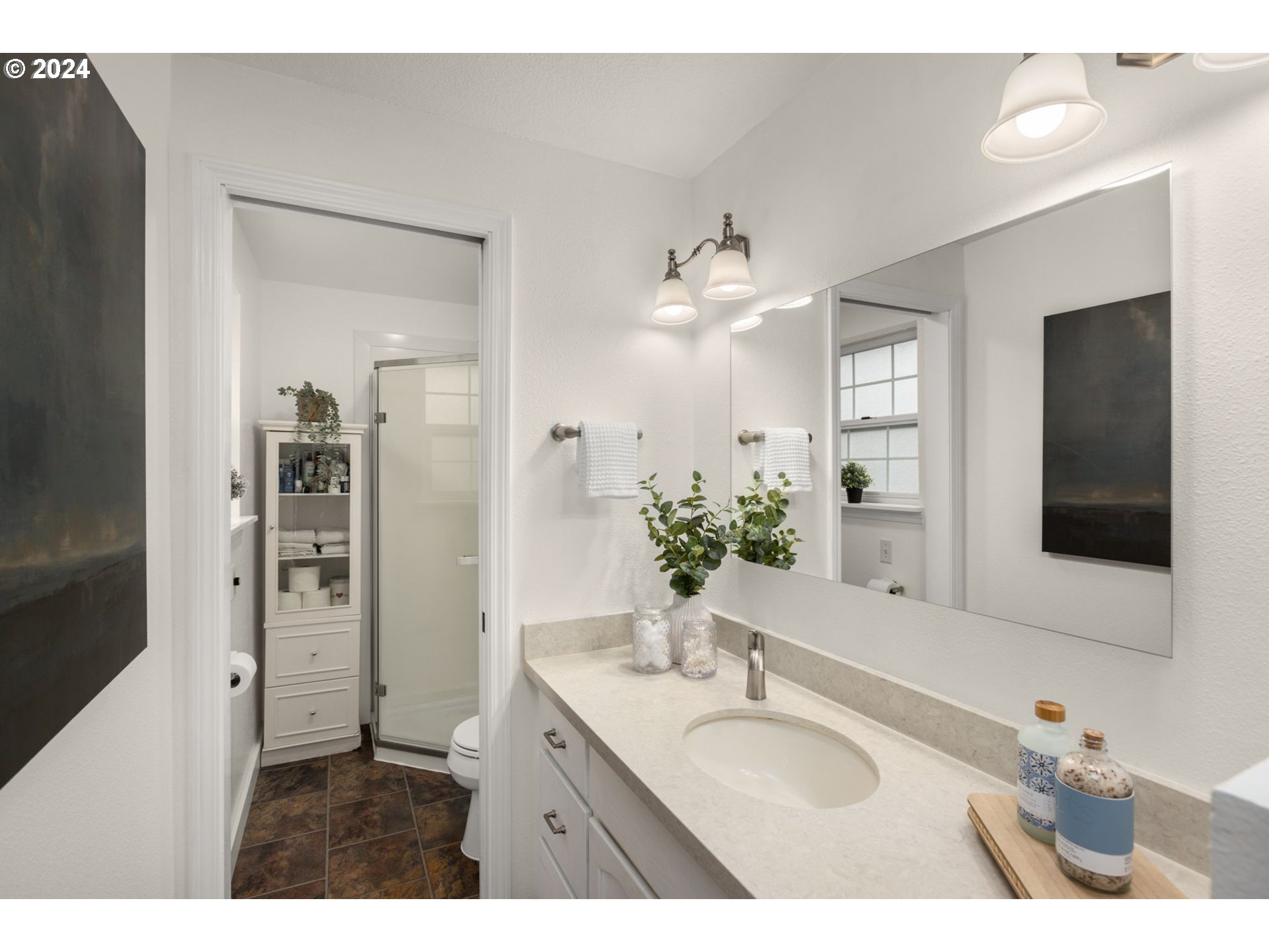 3625 Southwest Vacuna Street Portland, OR 97219 - Photo 18 of 27 a bathroom with a sink vanity granite and a mirror