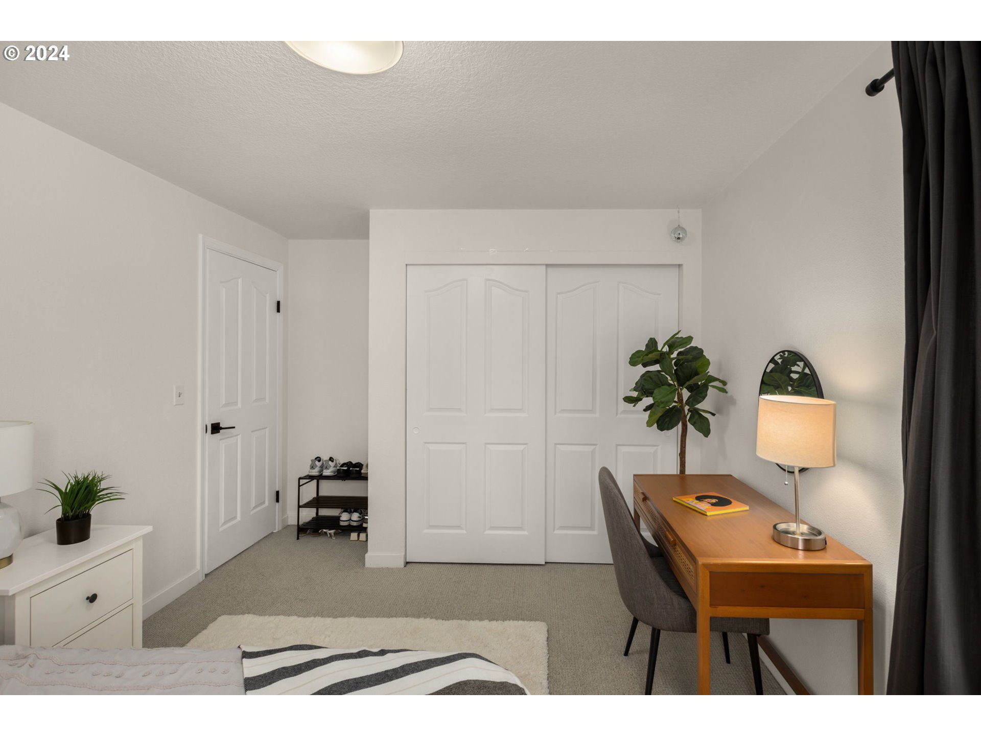 3625 Southwest Vacuna Street Portland, OR 97219 - Photo 23 of 27 a living room with furniture and a potted plant