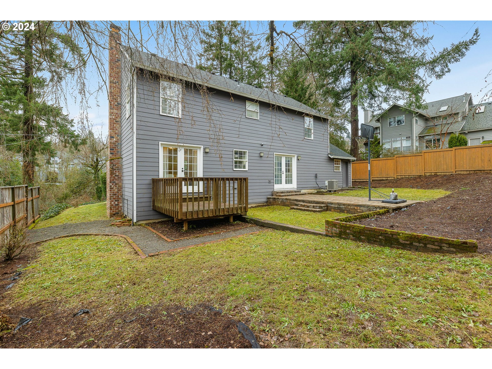 3625 Southwest Vacuna Street Portland, OR 97219 - Photo 25 of 27 a view of a house with backyard and sitting area