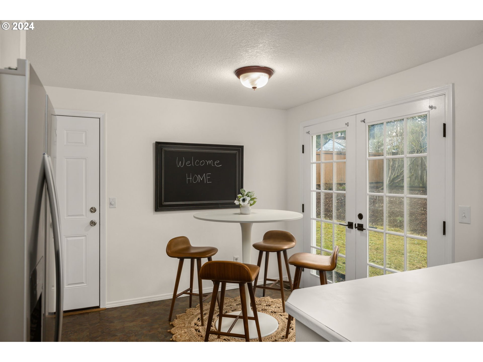 3625 Southwest Vacuna Street Portland, OR 97219 - Photo 9 of 27 a living room with furniture and a floor to ceiling window