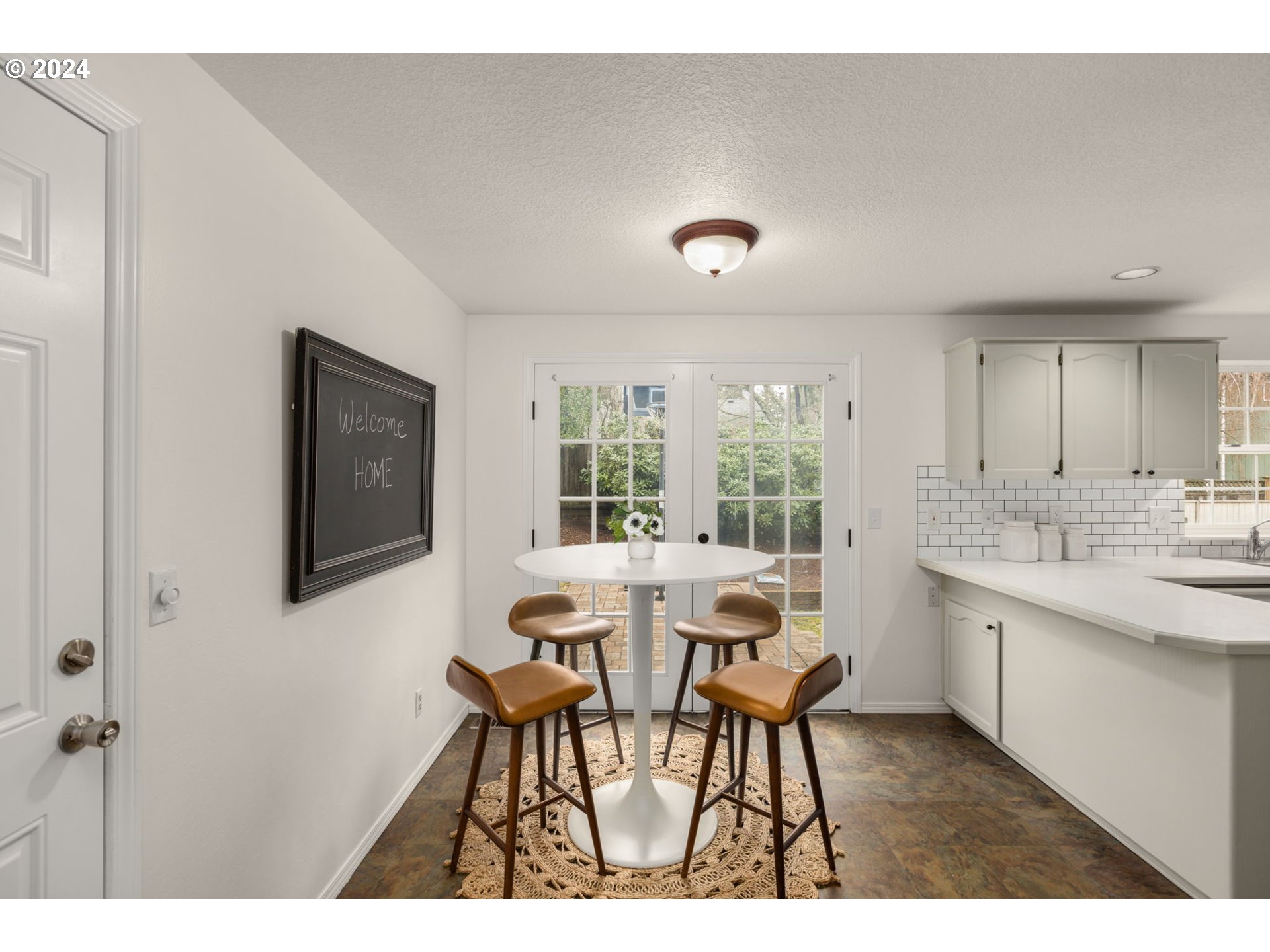 3625 Southwest Vacuna Street Portland, OR 97219 - Photo 10 of 27 a view of a dining room with furniture and window
