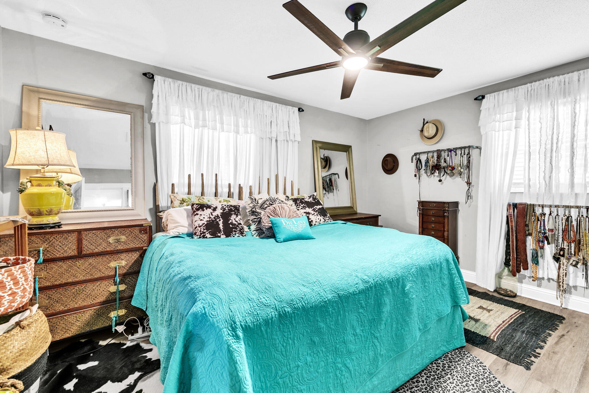 90 Jones Drive Freeport, FL 32439 - Photo 11 of 44 a bed room with a bed window and a chandelier