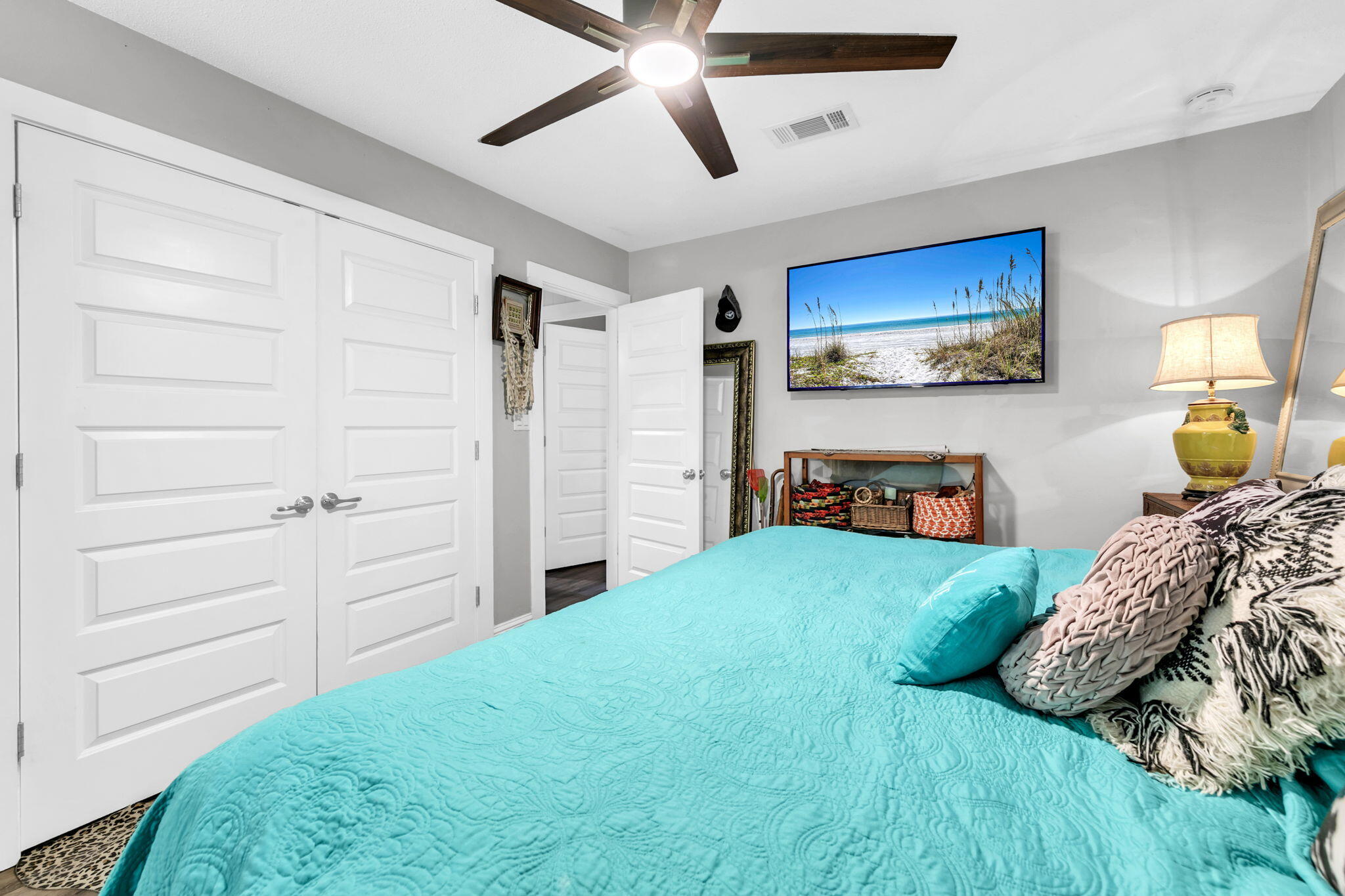 90 Jones Drive Freeport, FL 32439 - Photo 12 of 44 a bedroom with a bed and a flat tv screen