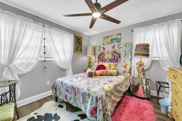 a bedroom that has a bed and a window