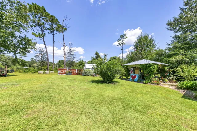 a view of a house with a big yard
