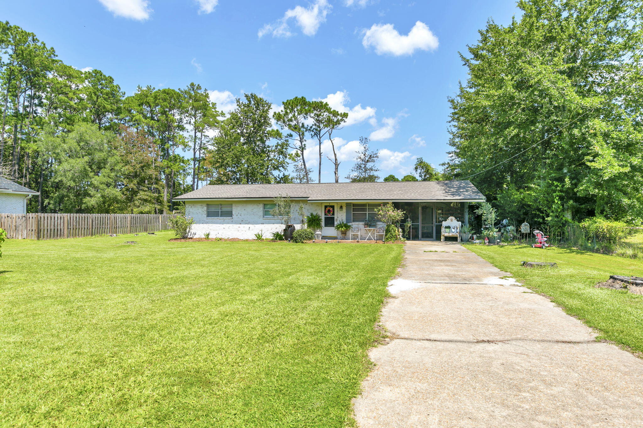 90 Jones Drive Freeport, FL 32439 - Photo 41 of 44 a front view of a house with a yard