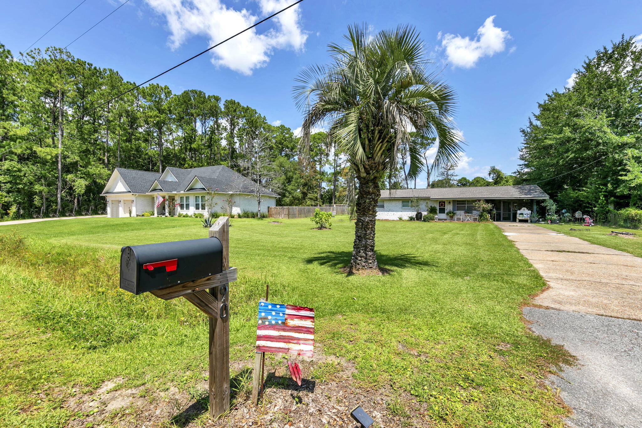 90 Jones Drive Freeport, FL 32439 - Photo 6 of 44 a backyard of a house with table and chairs