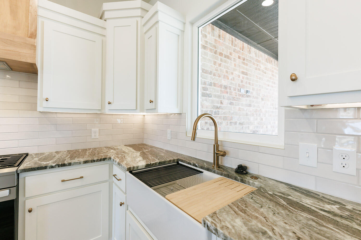 3634 144th Street Lubbock, TX 79423 - Photo 17 of 55 a kitchen with granite countertop white cabinets and sink