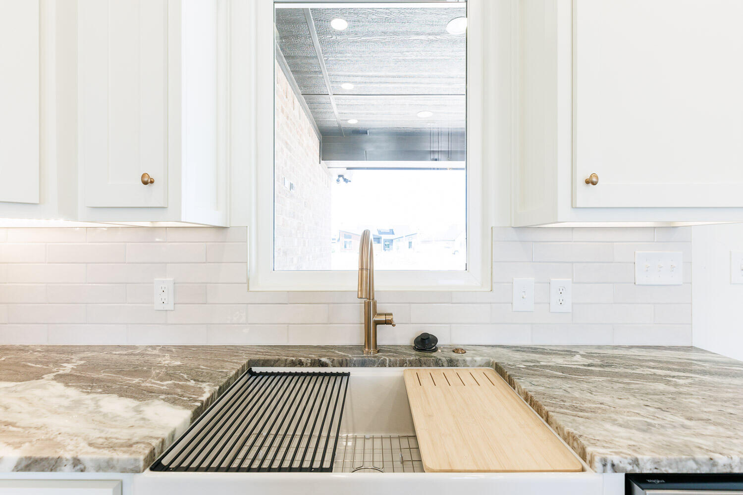 3634 144th Street Lubbock, TX 79423 - Photo 18 of 55 a view of a kitchen sink and dishwasher with wooden floor