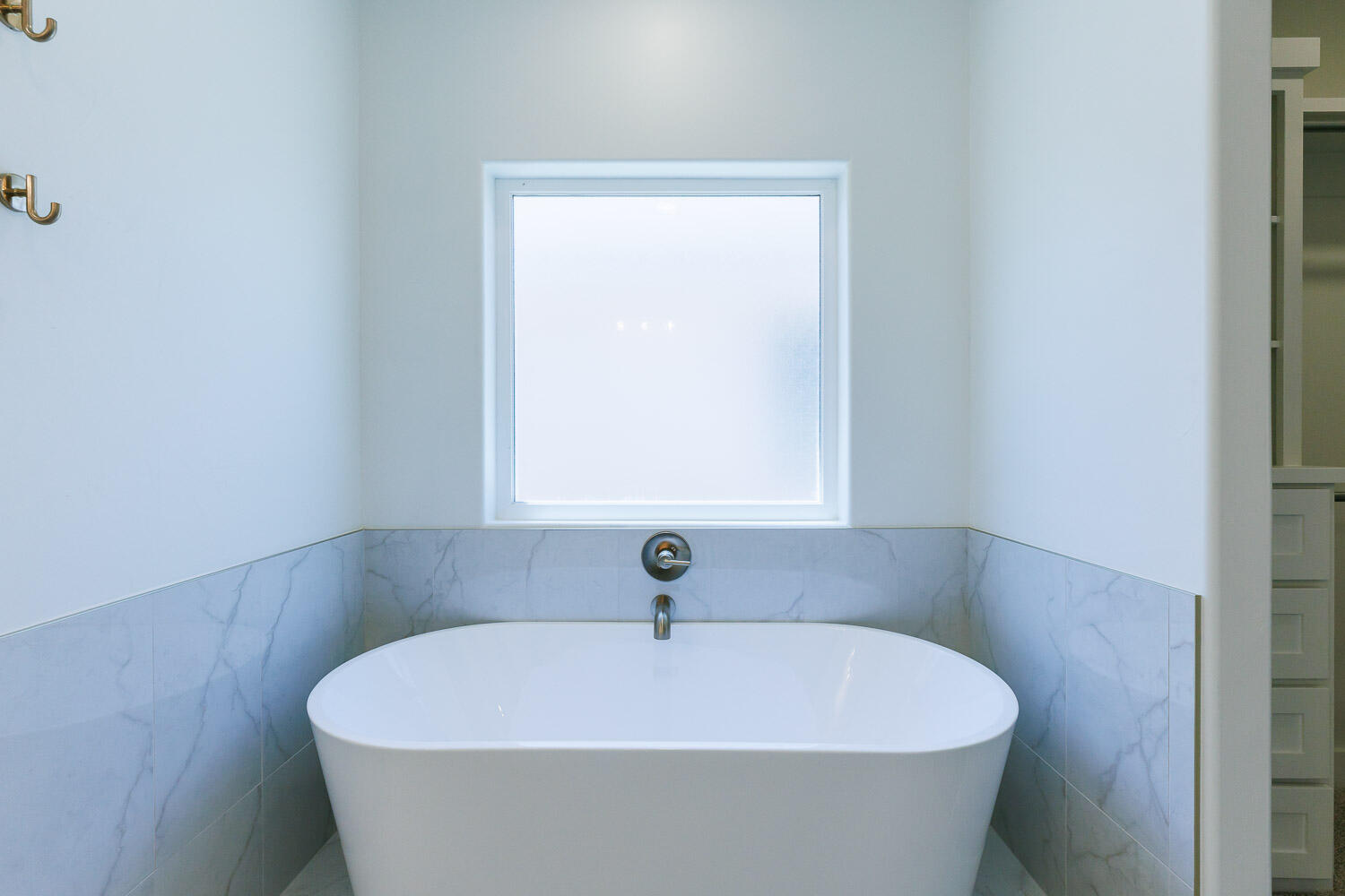 3634 144th Street Lubbock, TX 79423 - Photo 29 of 55 a white bath tub sitting in a bathroom