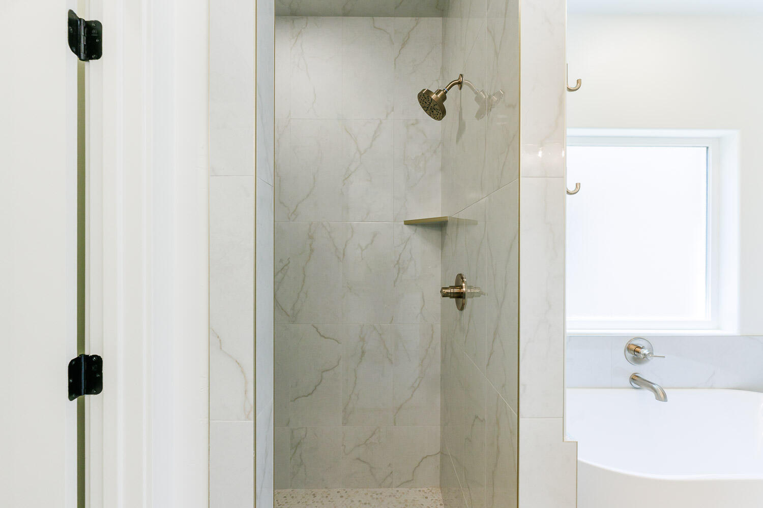 3634 144th Street Lubbock, TX 79423 - Photo 30 of 55 a bathroom with a sink a glass door shower and a mirror