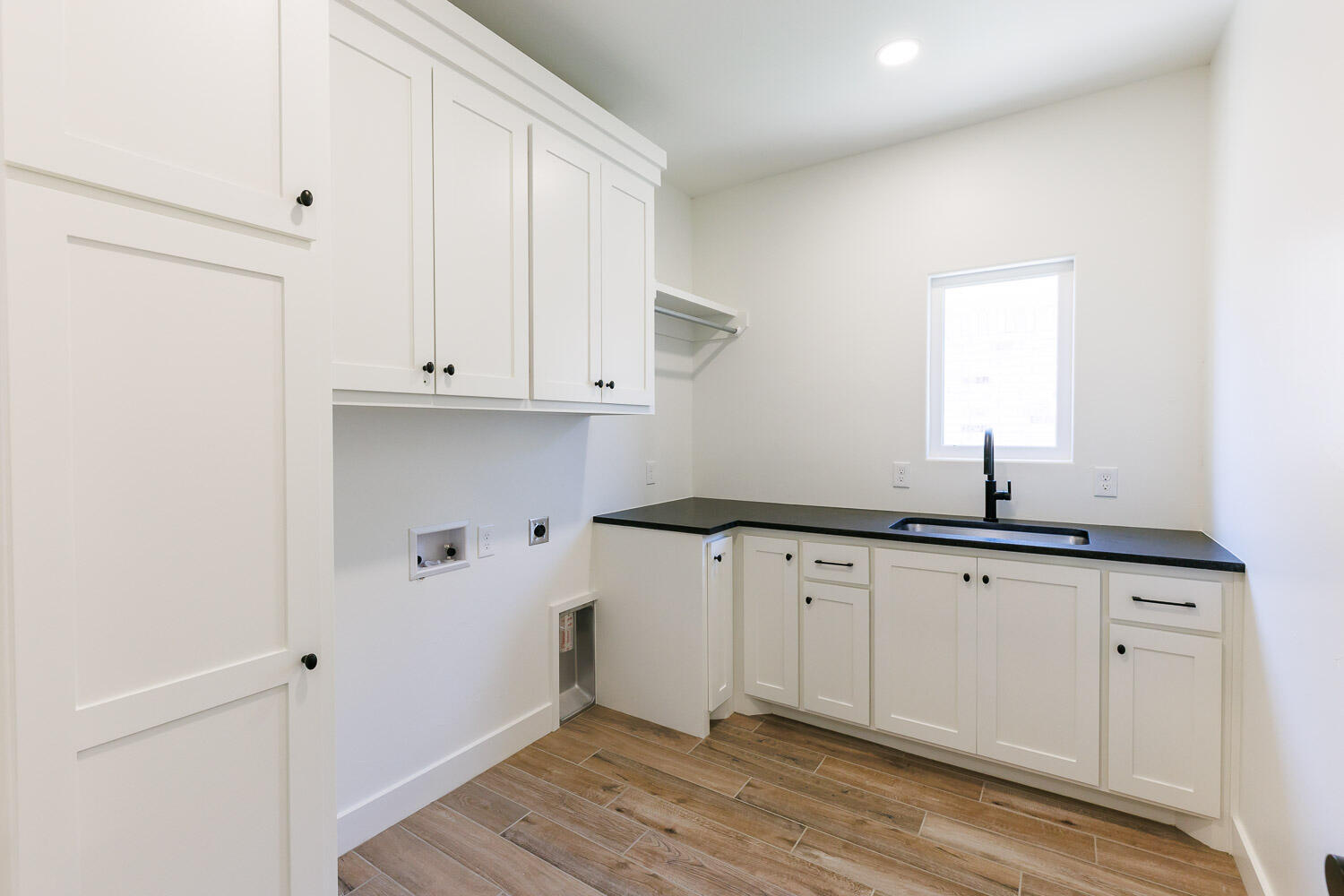 3634 144th Street Lubbock, TX 79423 - Photo 49 of 55 a kitchen with granite countertop white cabinets and a sink
