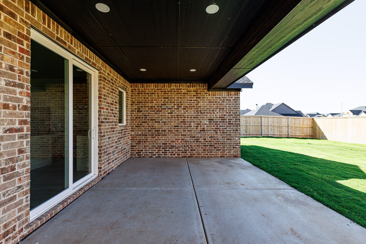 3634 144th Street Lubbock, TX 79423 - Photo 53 of 55 a view of a porch with wooden walls and a yard