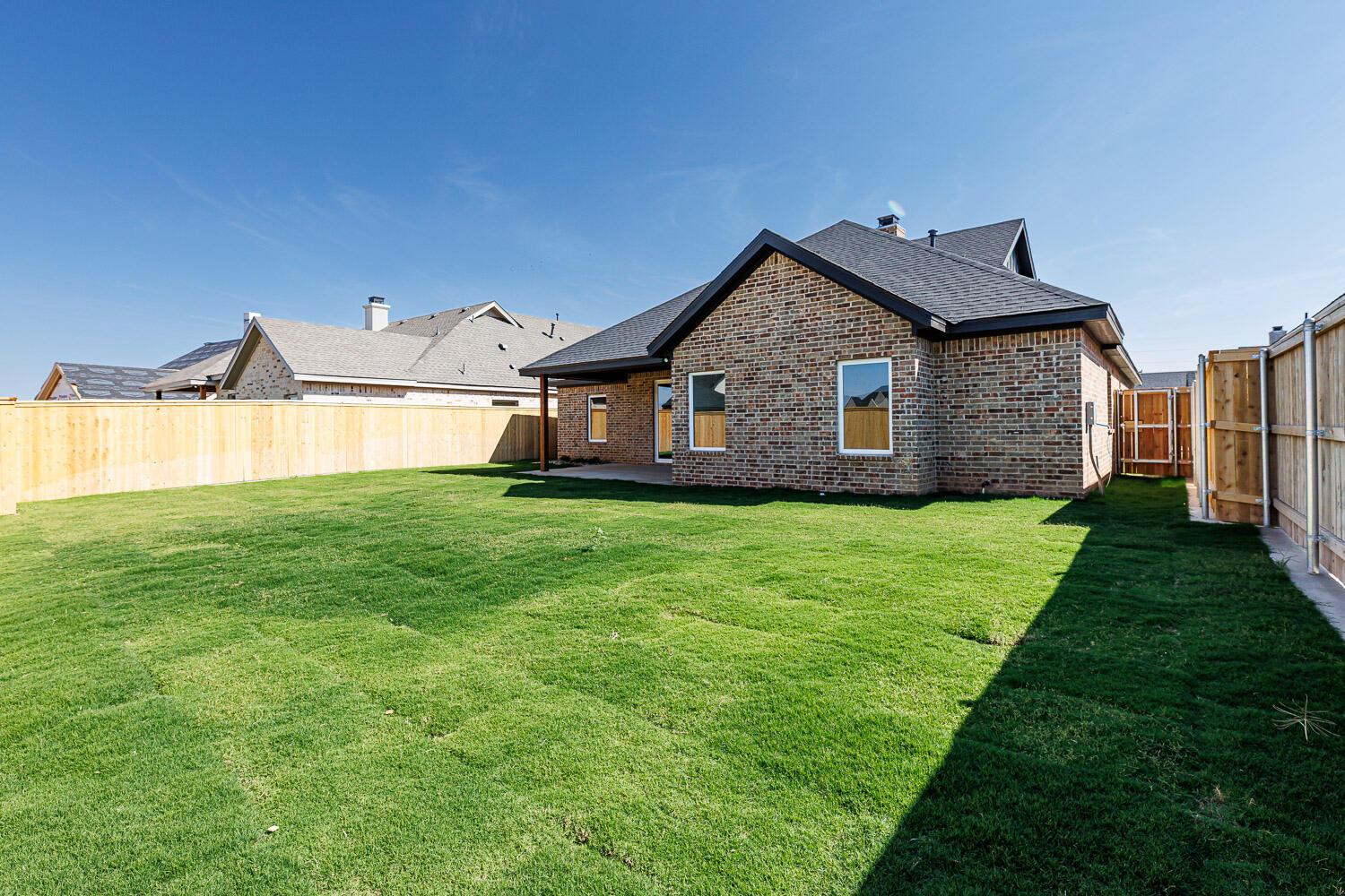 3634 144th Street Lubbock, TX 79423 - Photo 55 of 55 a front view of a house with a garden and yard