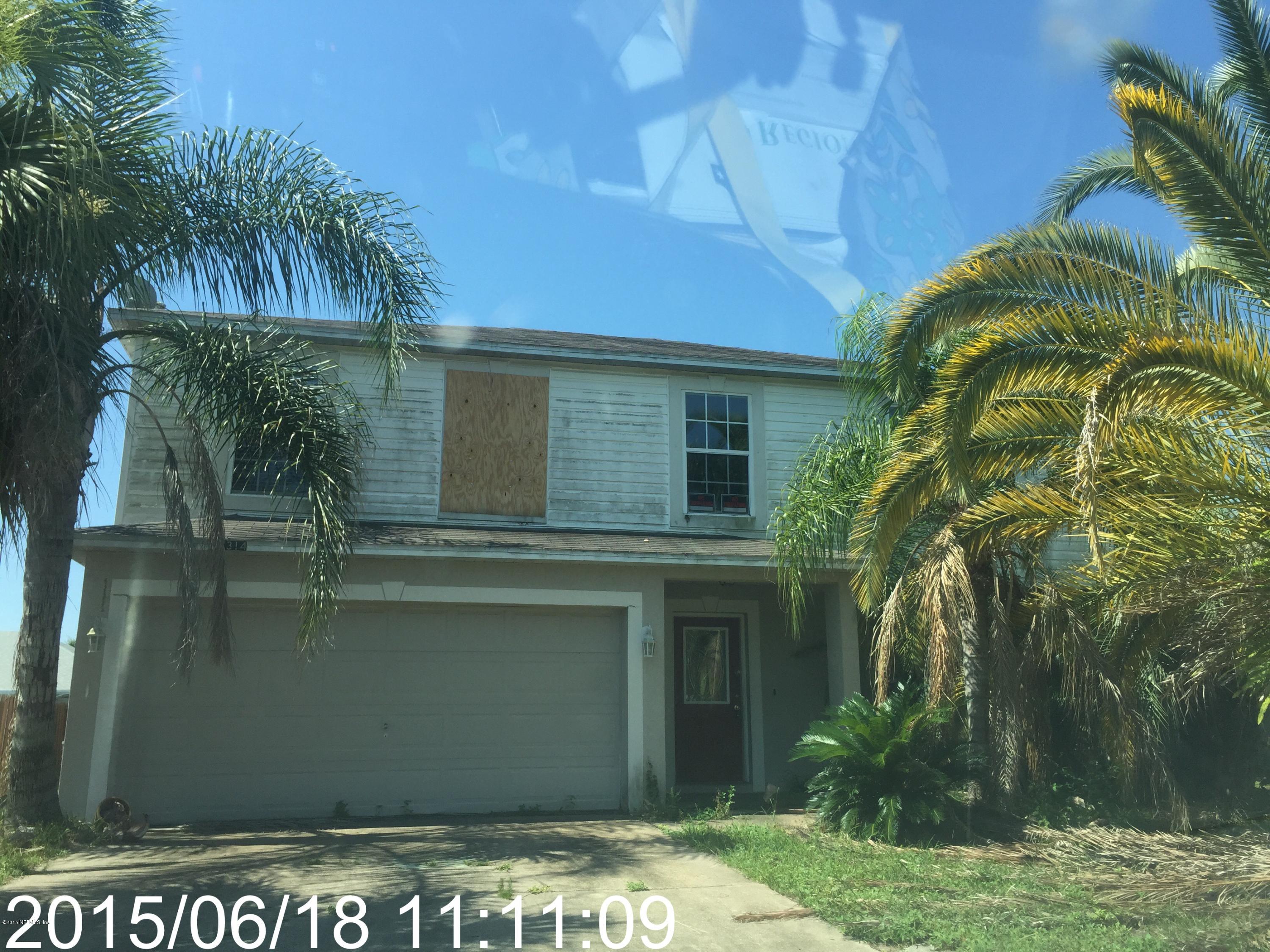 7314 High Bluff Road North Jacksonville, FL 32244 - Photo 8 of 8 a view of a house with a yard