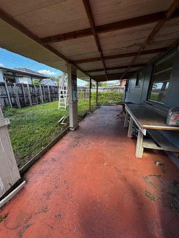 a black and white building with yard