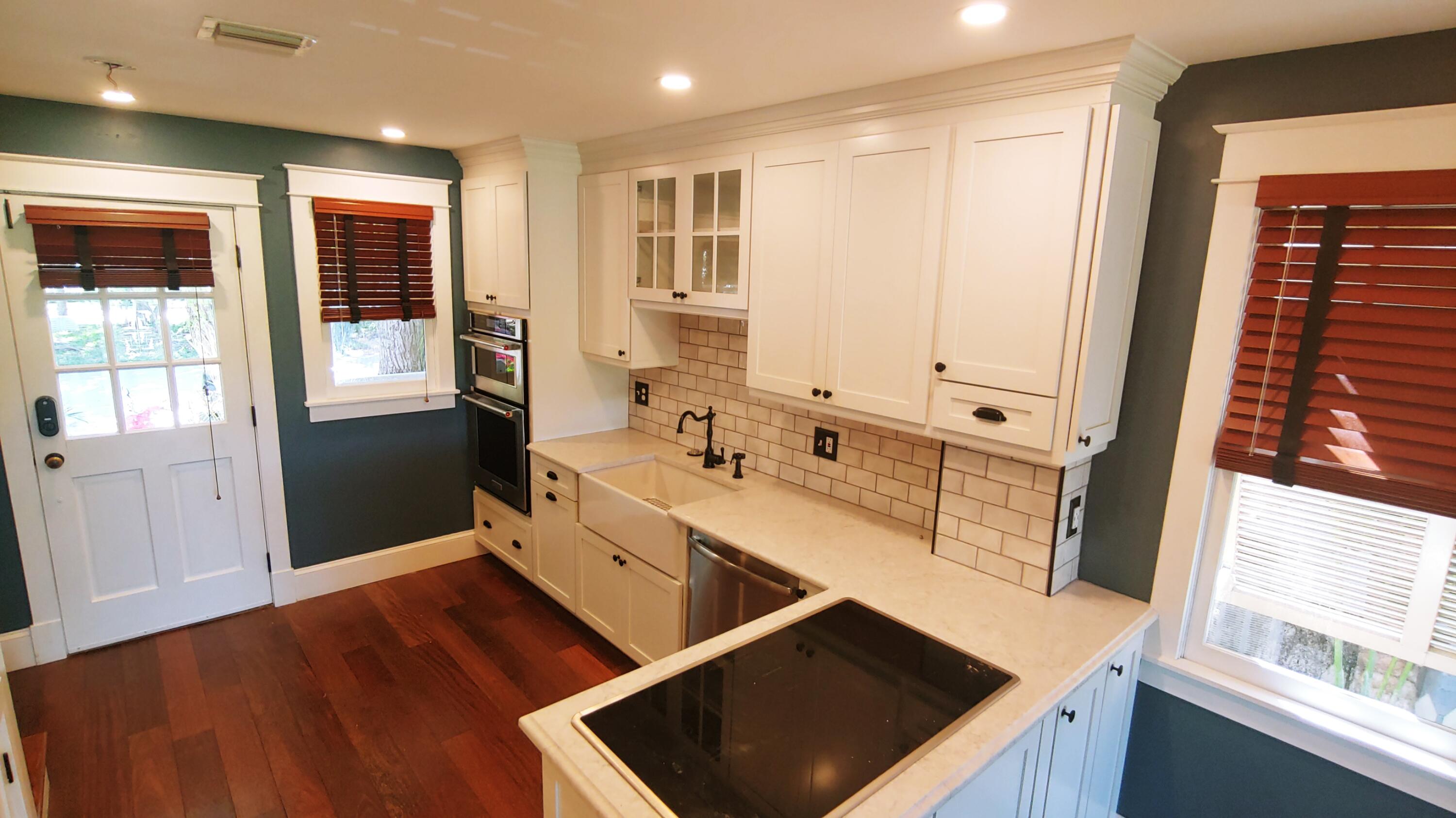 22 Merganser Lane Key West, FL 33040 - Photo 23 of 46 a large kitchen with stainless steel appliances a large window a sink and a counter top space