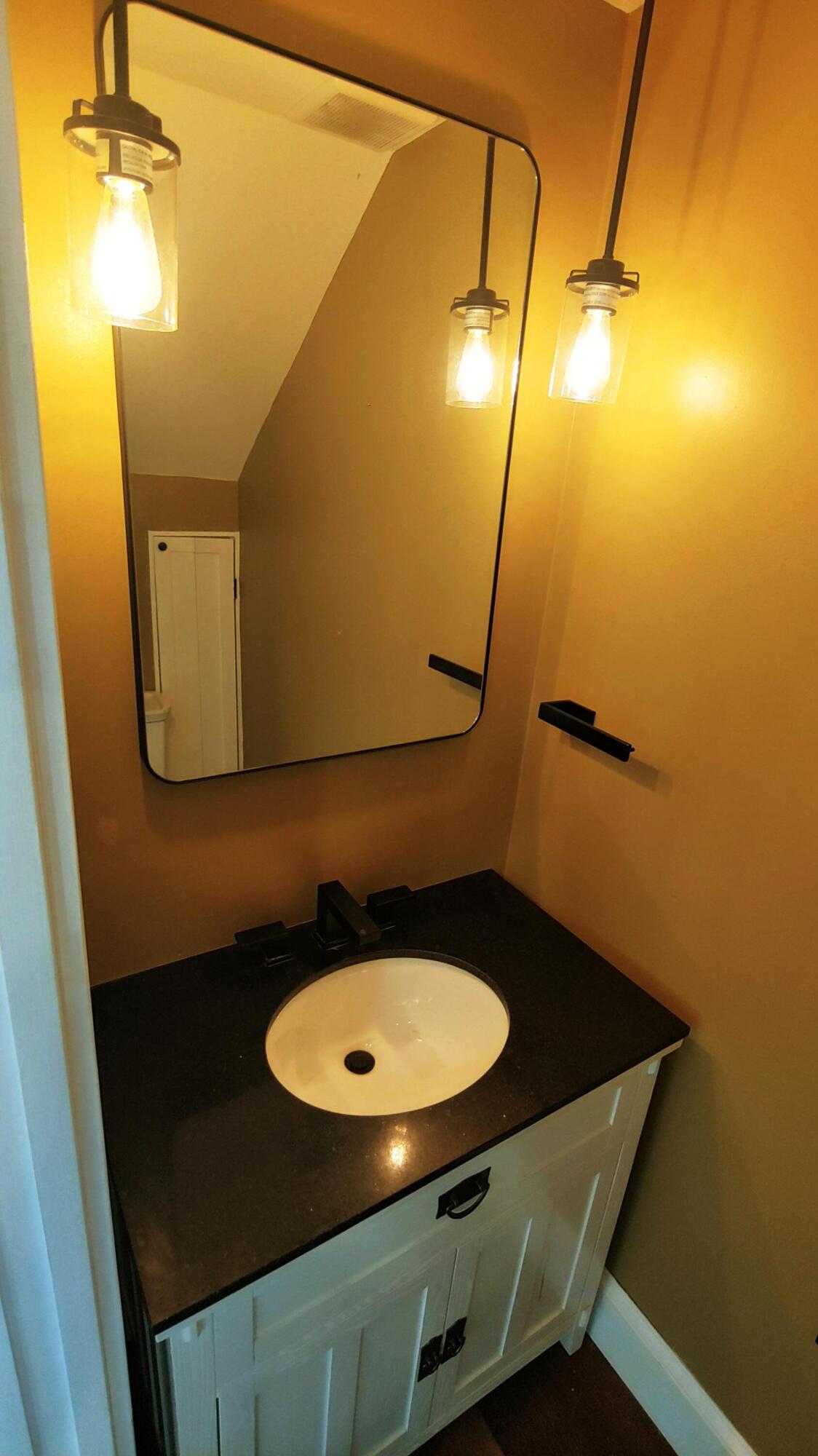 22 Merganser Lane Key West, FL 33040 - Photo 29 of 46 a bathroom with a sink mirror vanity and toilet