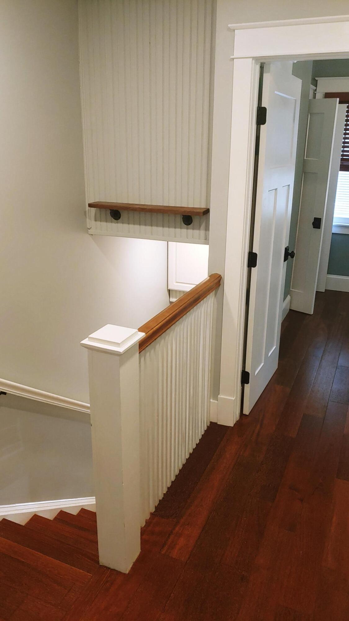22 Merganser Lane Key West, FL 33040 - Photo 37 of 46 a view of a hallway with wooden floor and staircase