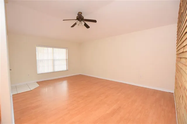 a view of empty room with windows